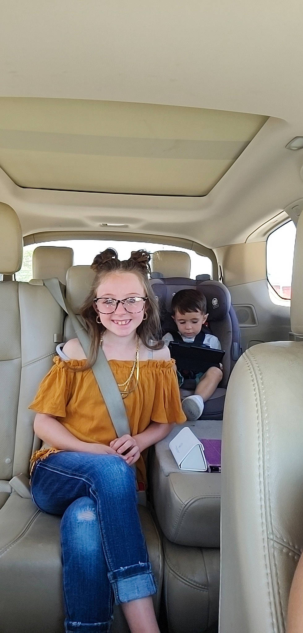 Karleigh is registered to the contest to win money with this photo: air_travel, auto_part, automotive_design, car, car_seat, car_seat_cover, clothing, comfort, head_restraint, joy, mode_of_transport, motor_vehicle, passenger, person, personal_luxury_car, seat_belt, smile, travel, vehicle, vehicle_door