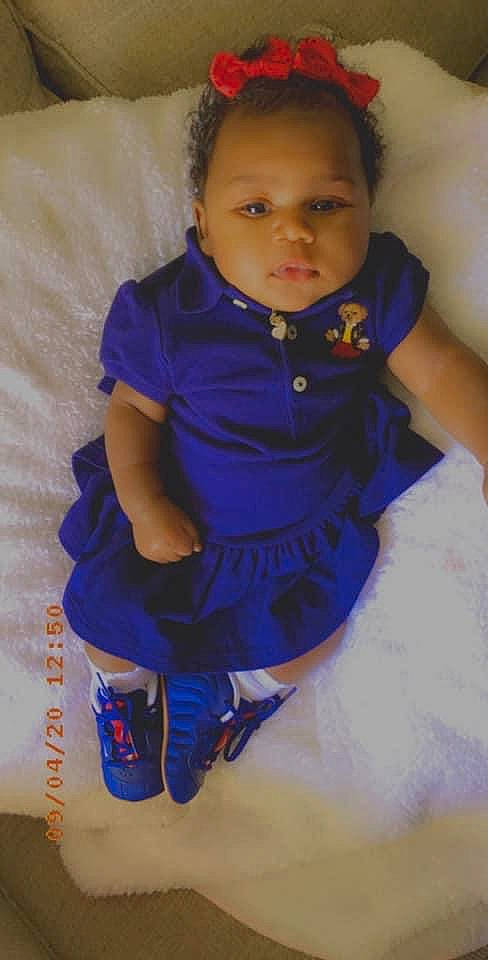 Chloe is registered to the contest to win money with this photo: arm, baby, baby_toddler_clothing, blue, cheek, child, cobalt_blue, electric_blue, person, purple, sitting, standing, toddler