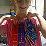 Amberlyn joined the competition — help win amazing prizes! achievement, award, background, cabinet, celebration, chair, child, face, hand, happy, indoors, lamp, person, pink_clothing, proud, quizzing, ribbons, smile, tshirt, young