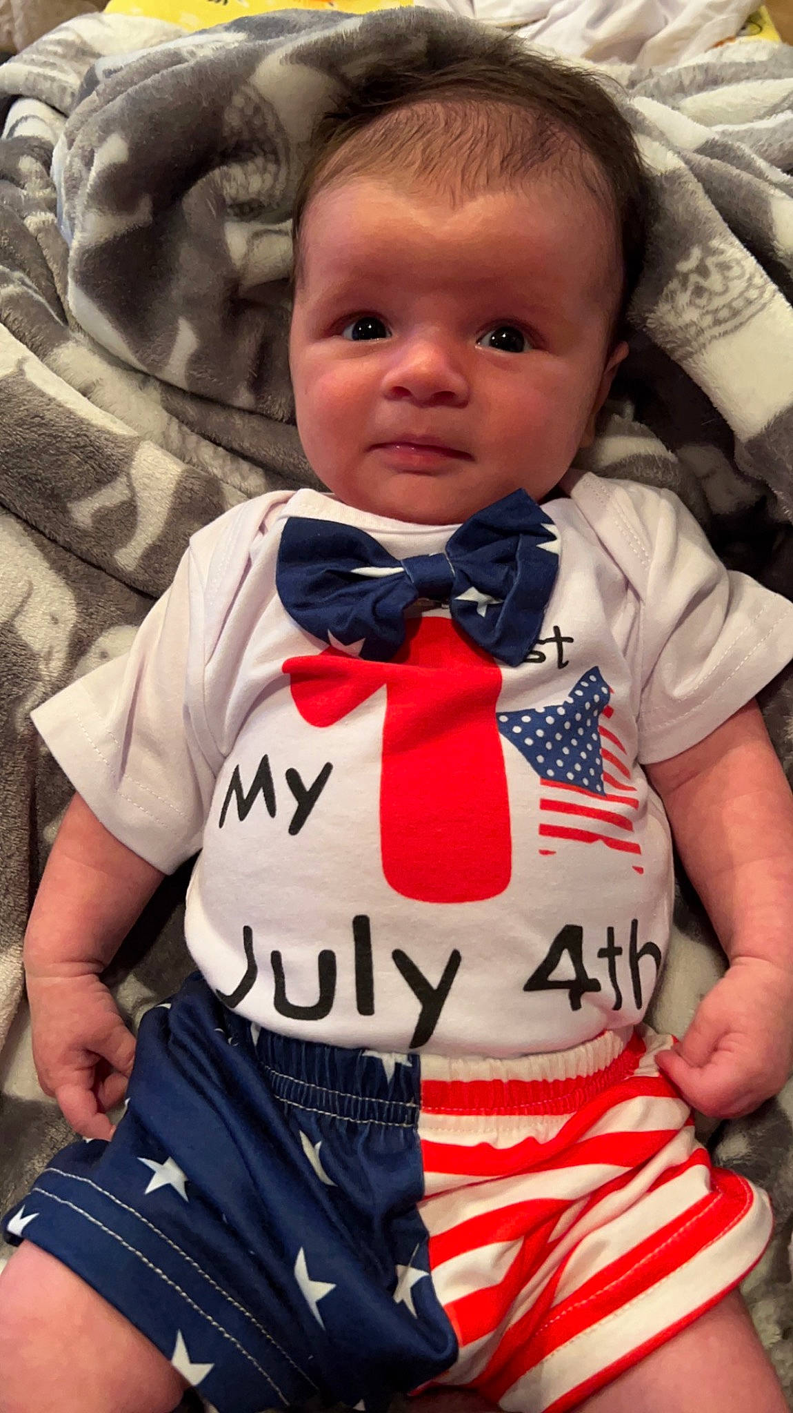 Caleb is registered to the contest to win money with this photo: baby, baby_products, baby_toddler_clothing, cheek, child, comfort, cool, design, eye, face, happy, head, neck, nose, pattern, person, skin, sleeve, t_shirt, textile