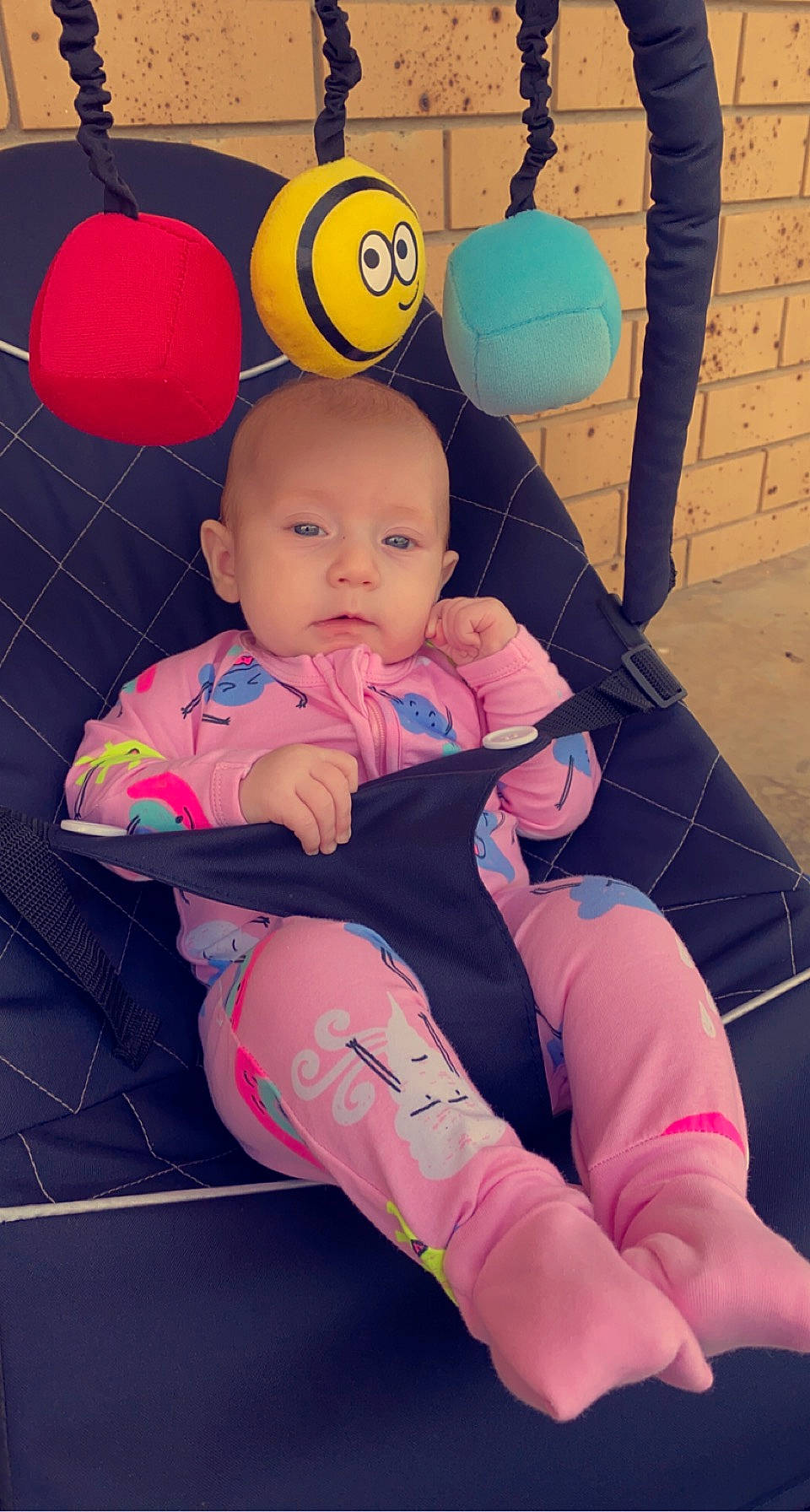 Willow is registered to the contest to win money with this photo: baby, baby_playing_with_toys, baby_toddler_clothing, child, comfort, finger, flooring, foot, fun, happy, human_leg, knee, lap, leisure, magenta, orange, person, pink, sock, thigh