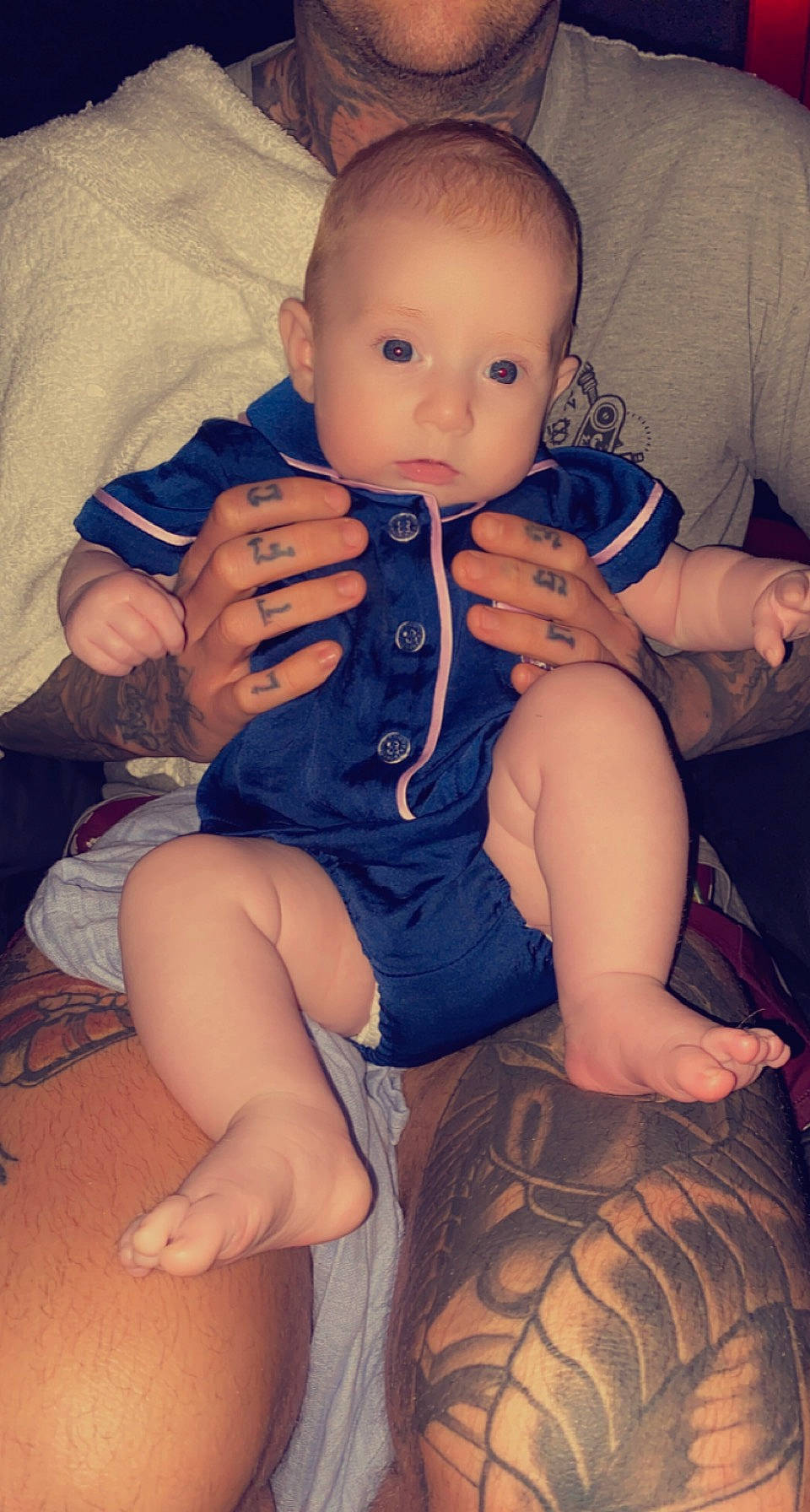 Willow is registered to the contest to win money with this photo: baby_toddler_clothing, blue, cheek, comfort, eye, finger, flash_photography, hand, iris, joint, leg, lip, mouth, muscle, neck, nose, organ, person, skin, sleeve