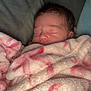 Laikelynn is registered to the contest to win money with this photo: baby, blanket, sleeping, newborn, soft, pink, white, face, peaceful, cozy, infant, wrapped, cute, portrait, child, resting, indoors, closeup, comfortable, warm
