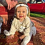 Ninon a rejoint le concours — aidez-le/la à gagner de superbes lots ! adult, baby, blue_eyes, cardigan, child, crawling, footwear, grass, hands, headband, nature, outdoor, patterned_rug, person, red_car, rug, smiling, sunlight, vintage_car, white_clothing