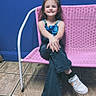 Raelynn is registered to the contest to win money with this photo: blue_wall, casual_clothing, chair, child, cross_legged, denim, full_body, girl, happy, indoor, outdoor_furniture, overalls, photography, pink_chair, ponytail, portrait, sitting, smiling, tile_floor, white_sneakers