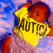 Jakyree joined the competition — help win amazing prizes! baby, blanket, casual_clothing, child, cozy, cute, gray_shorts, hands_behind_head, indoor, infant, peaceful, portrait, relaxed, resting, sleeping, small, soft_texture, toddler, white_socks, yellow_shirt