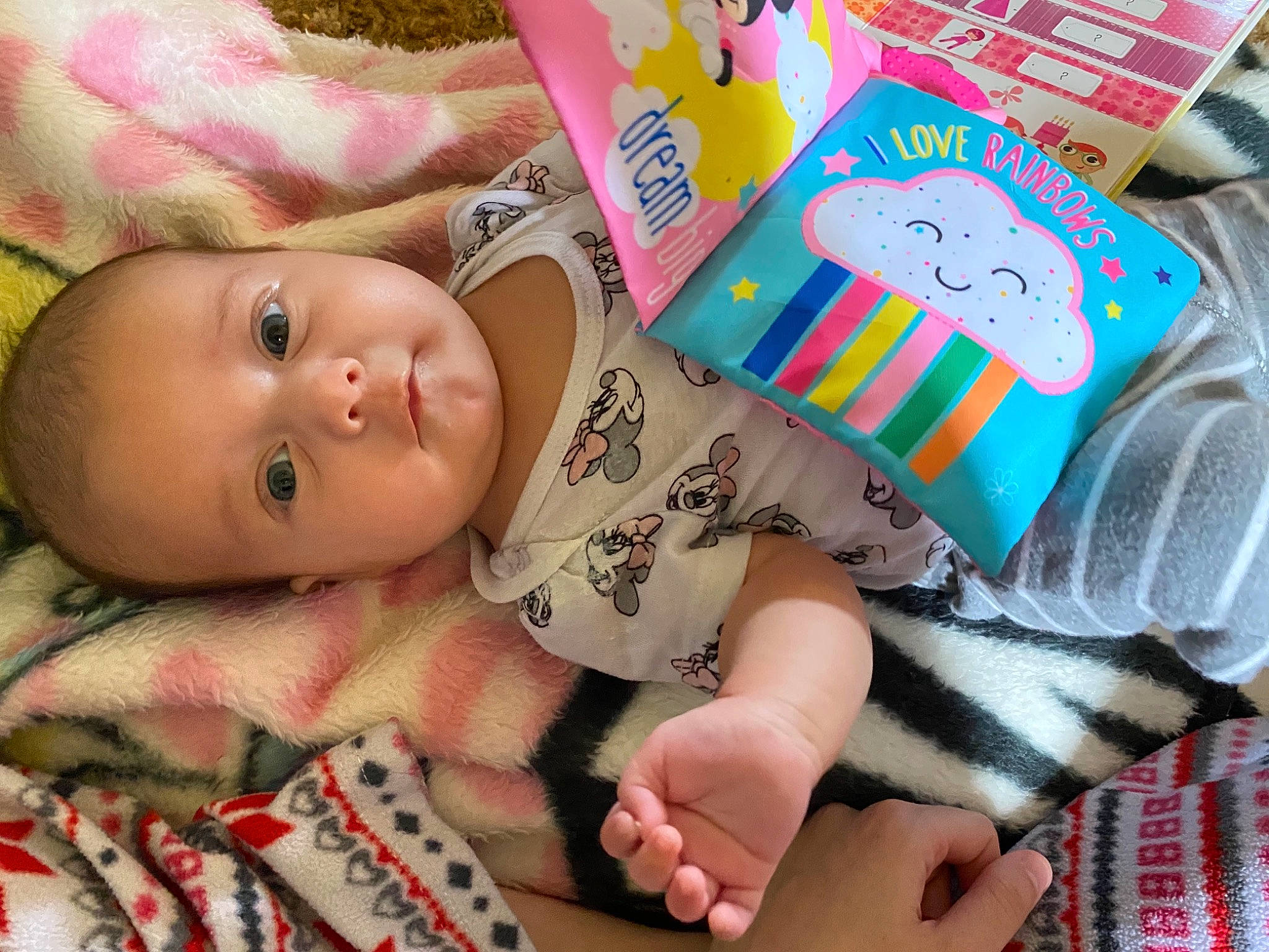 Sarah joined the competition — help win amazing prizes! baby, baby_products, baby_toddler_clothing, baby_toys, bedtime, cheek, child, comfort, face, fashion_accessory, hand, headgear, human_body, linens, mammal, person, pink, room, skin, toddler