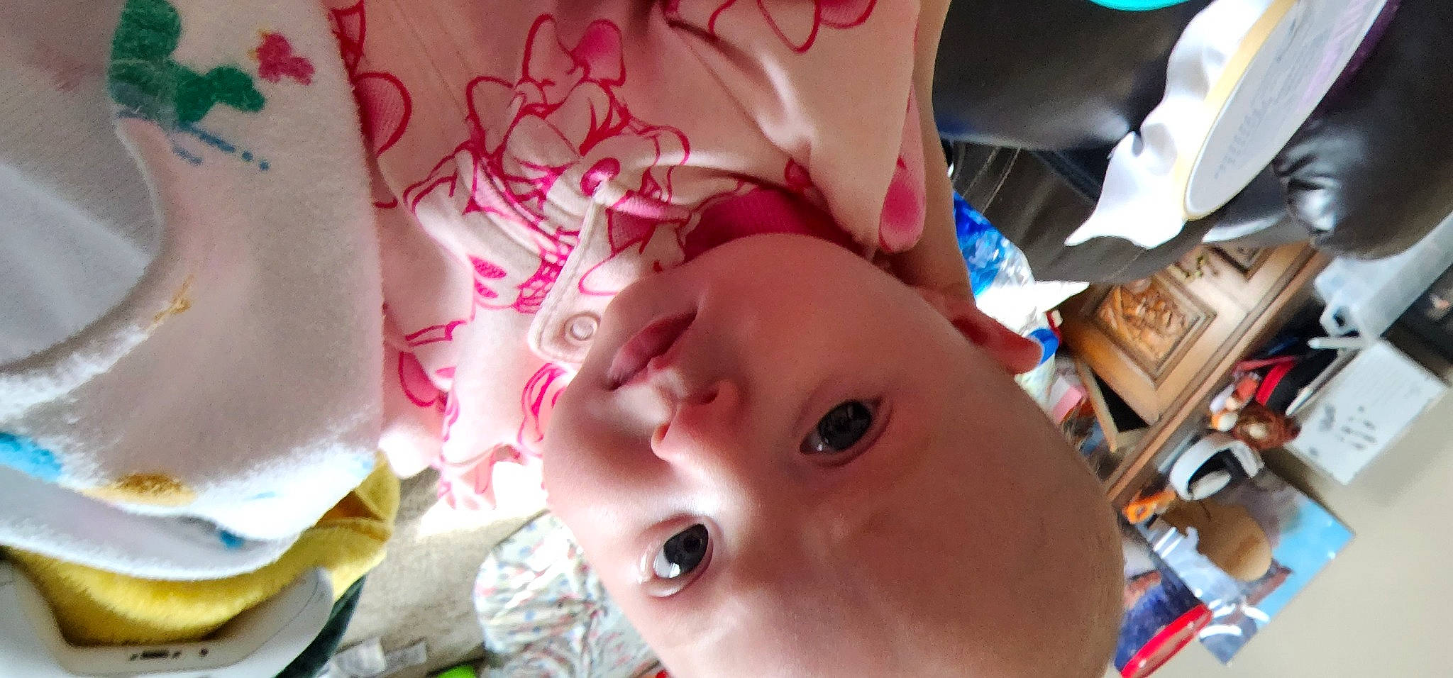 Leia is registered to the contest to win money with this photo: baby, carmine, cheek, child, close_up, ear, eyebrow, eyelash, fun, happy, headgear, lip, magenta, mouth, nose, person, pink, room, selfie, skin