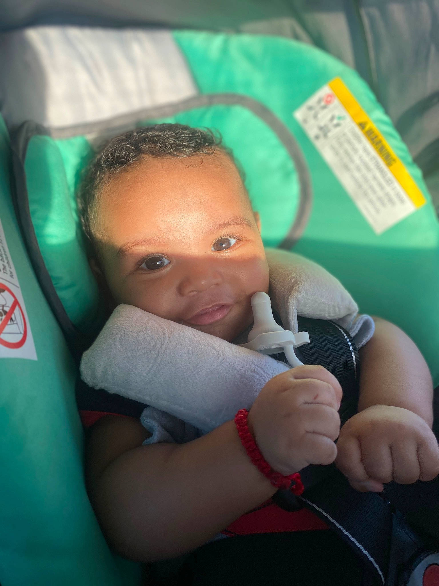 De'Marcus joined the competition — help win amazing prizes! arm, baby, baby_carriage, baby_products, baby_safety, car_seat, child, comfort, facial_expression, finger, fun, hand, happy, leisure, linens, mouth, person, room, sitting, skin