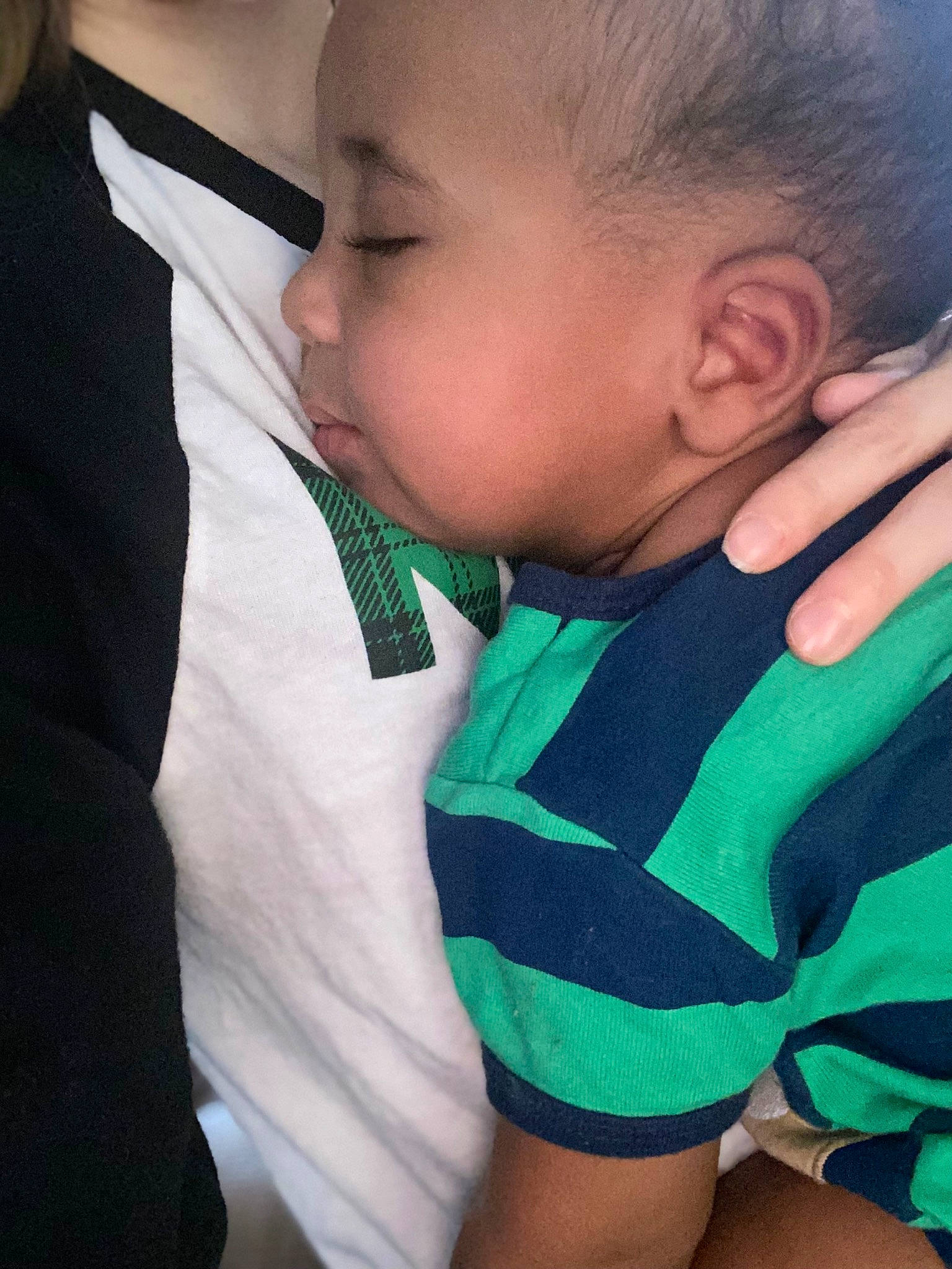 Braiden is registered to the contest to win money with this photo: baby_toddler_clothing, cheek, chin, comfort, eye, eyebrow, hair, hand, happy, head, human_body, iris, mouth, neck, nose, outerwear, person, shirt, shoulder, skin