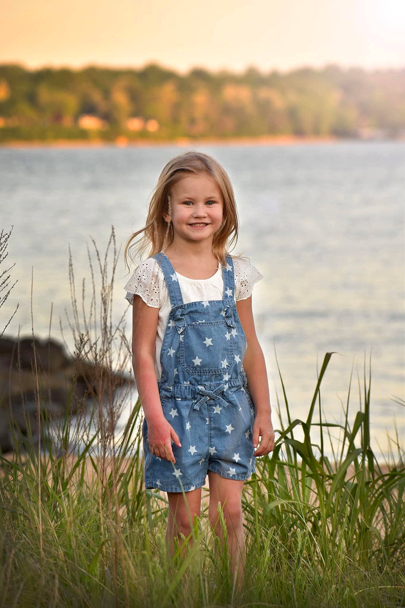 Audrina joined the competition — help win amazing prizes! bank, clothing, flash_photography, grass, grass_family, grassland, happy, joy, lake, meadow, natural_environment, nature, people_in_nature, person, plant, sky, standing, summer, sunlight, t_shirt
