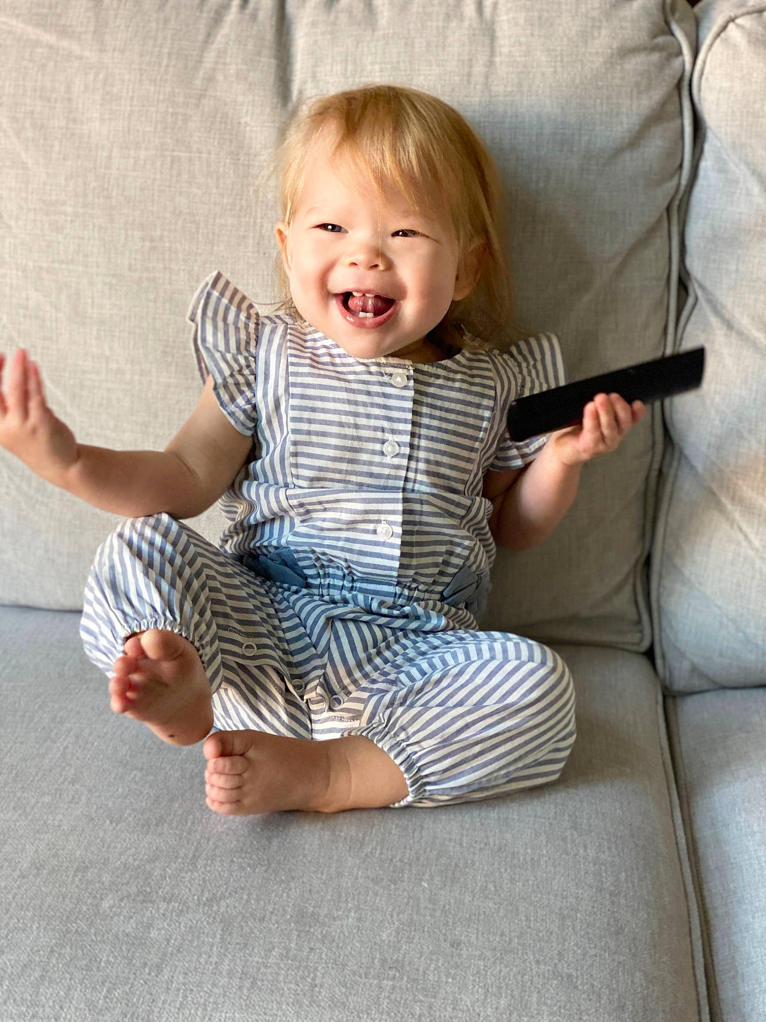 Anwyn is registered to the contest to win money with this photo: baby, baby_toddler_clothing, barefoot, comfort, face, finger, flooring, foot, gesture, hand, happy, head, human_body, knee, pattern, person, skin, sleeve, smile, t_shirt