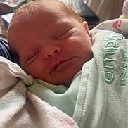 Caden is registered to the contest to win money with this photo: baby, blanket, child, closeup, clothing, cozy, cute, face, head, human, indoors, infant, newborn, peaceful, portrait, rest, skin, sleeping, soft, wrapped