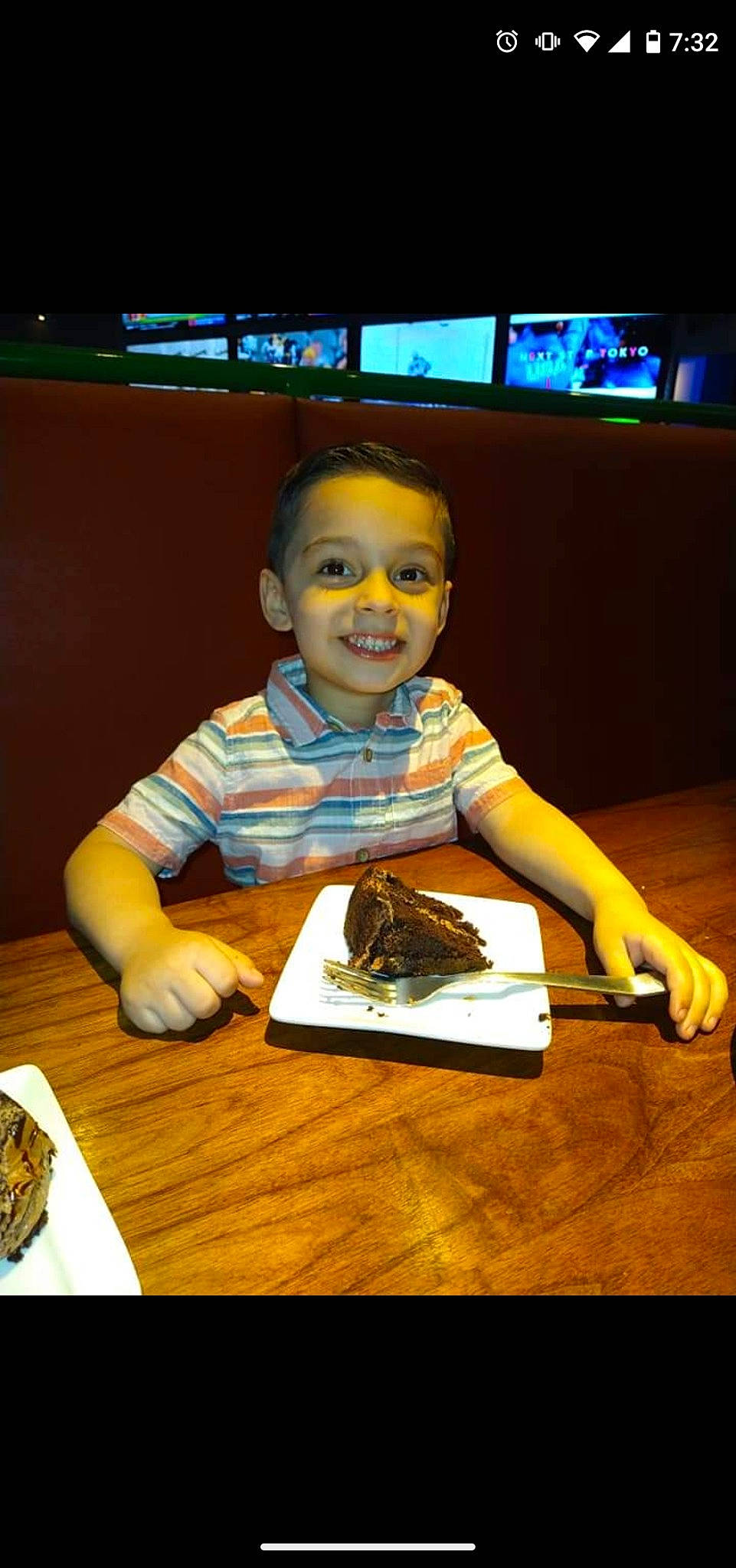 Elan joined the competition — help win amazing prizes! cake, child, comfort_food, cuisine, dessert, dish, flooring, fun, hardwood, joy, person, plate, recreation, room, sitting, smile, sweetness, t_shirt, table, tableware