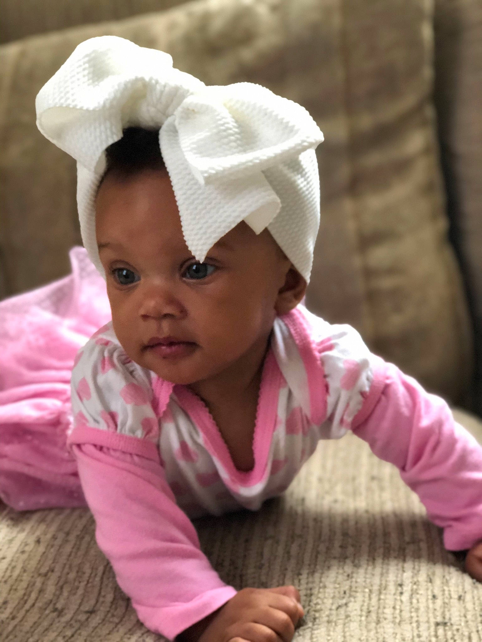 Jalani is registered to the contest to win money with this photo: baby, baby_toddler_clothing, beauty, bonnet, cheek, child, headgear, person, pink, skin, smile, toddler