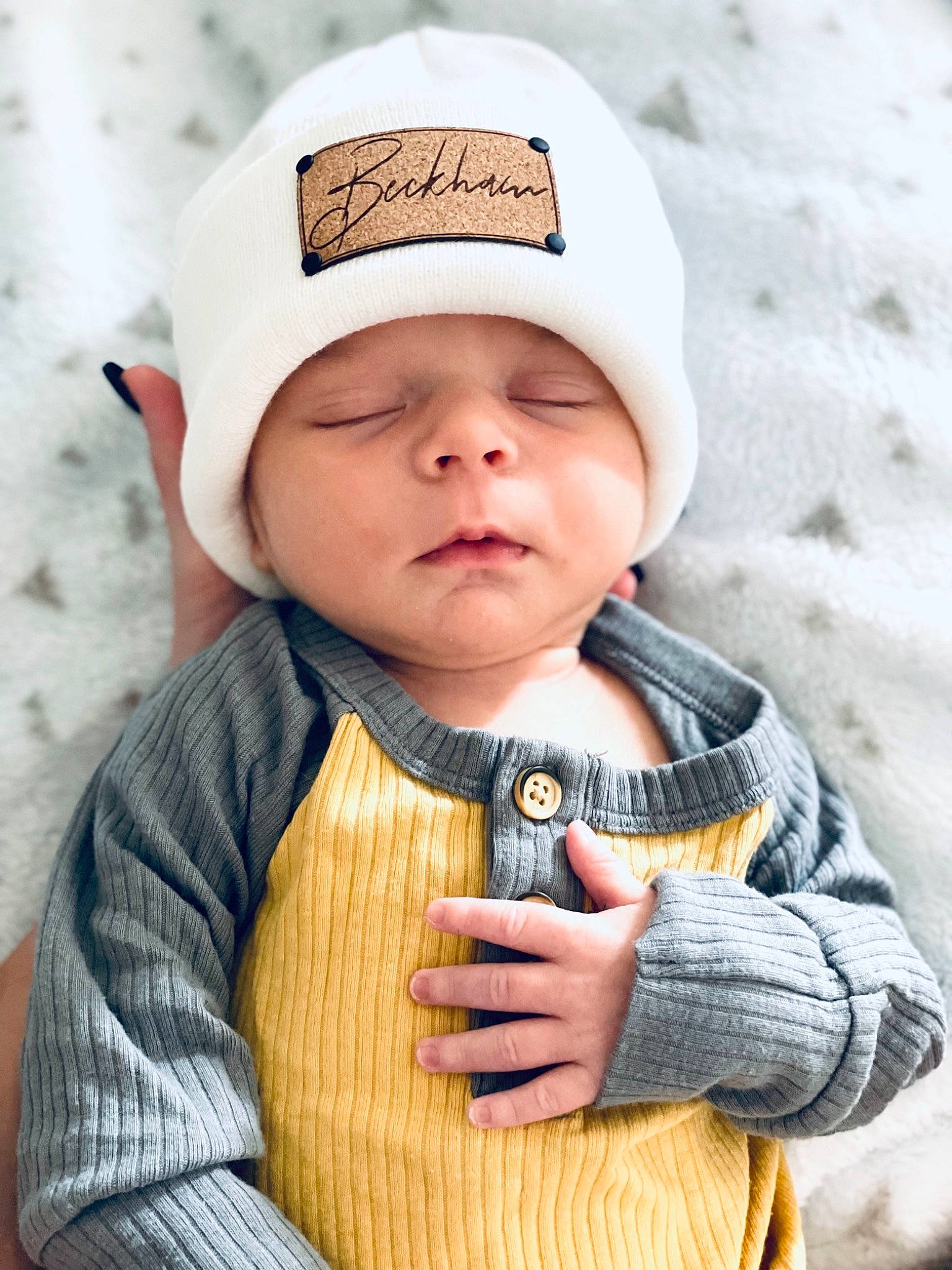 Beckham is registered to the contest to win money with this photo: baby, baby_toddler_clothing, cap, cheek, child, clothing, eye, finger, hand, happy, head, headgear, headwear, lip, organ, outerwear, person, skin, sleeve, street_fashion