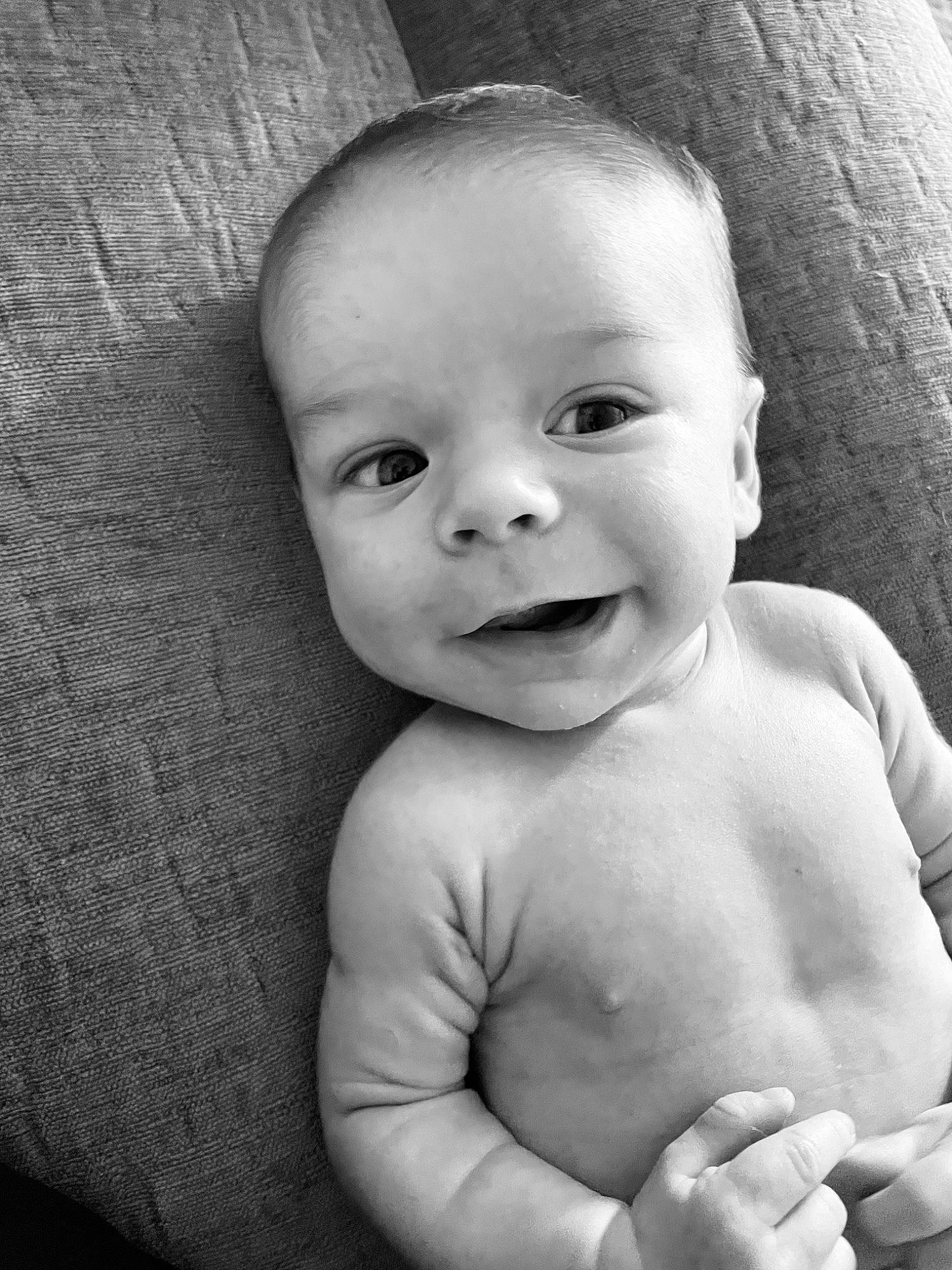 Beckham is registered to the contest to win money with this photo: arm, baby, cheek, chin, eye, eyebrow, face, facial_expression, flash_photography, head, human_body, iris, joy, lip, mouth, muscle, nose, person, skin, smile