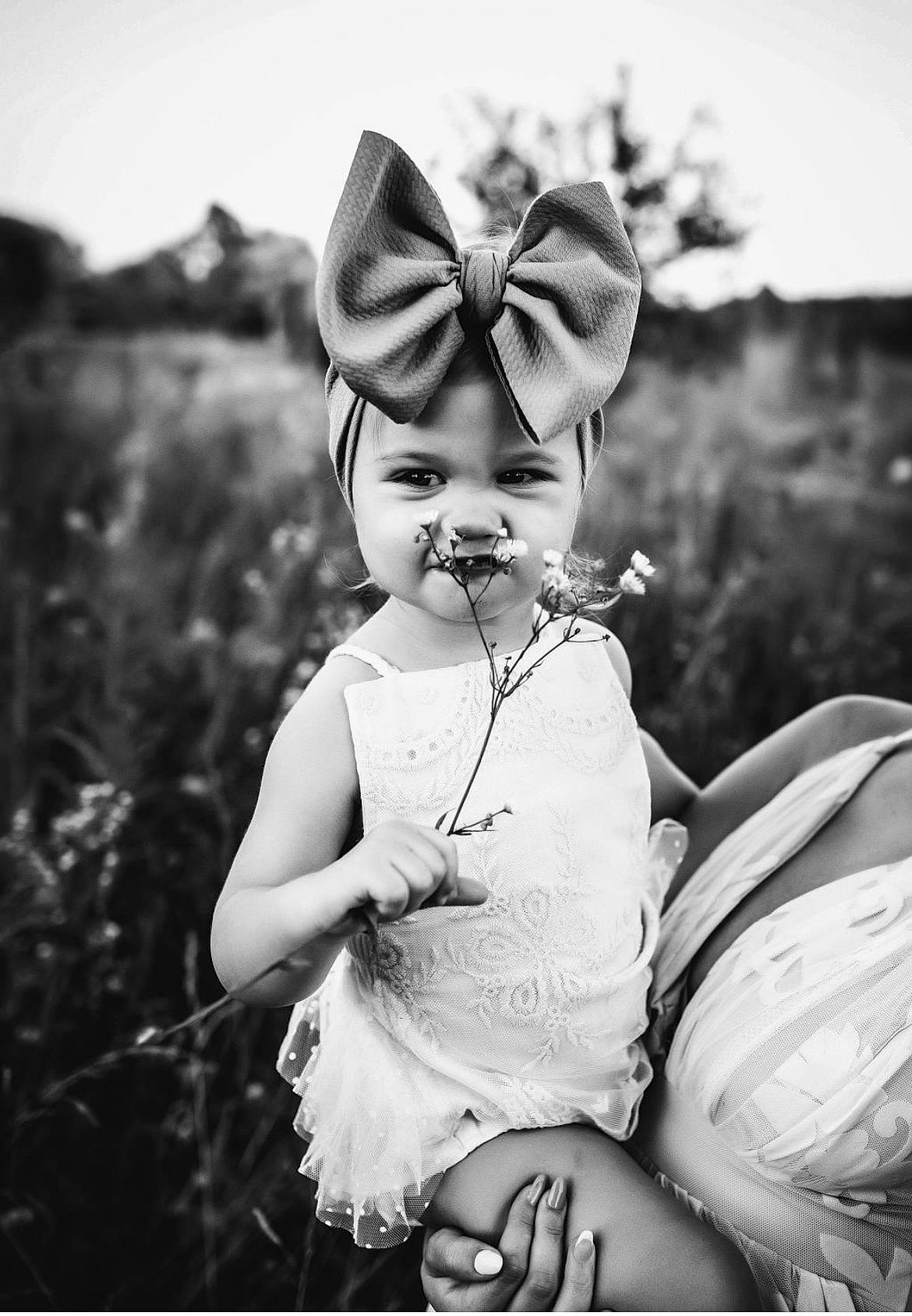 Ireland is registered to the contest to win money with this photo: black, black_and_white, eye, flash_photography, gesture, grass, hand, happy, head, headgear, headpiece, human_body, monochrome, monochrome_photography, people_in_nature, person, photograph, plant, standing, style