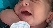 Makiah is registered to the contest to win money with this photo: baby, blanket, closeup, clothing, cozy, cute, face, hand, indoors, infant, mitten, newborn, peaceful, person, portrait, resting, sleeping, smiling, soft, young