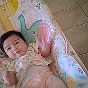 Layloni joined the competition — help win amazing prizes! baby, infant, child, rocker, baby_gear, colorful, animal_pattern, smiling, waving_hands, pastel_clothing, indoor, tiled_floor, comfort, cute, lying_down, playful, portrait, person, young_child, casual_photo