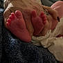 Kyson is registered to the contest to win money with this photo: baby, newborn, infant, feet, toes, tiny_toes, hand, adult_hand, ring, blanket, bedding, close_up, cozy, soft, skin, nail, wrinkle, bedroom, cuddle, family
