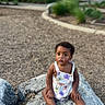 toddler, child, rock, outdoor, park, nature, trees, curious, romper, clothing, barefoot, grass, daylight, ground, person, young_child, sitting, expression, summer, playground