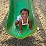 Ellen joined the competition — help win amazing prizes! baby, child, colorful_clothing, crawling, curious, cute, expression, face, fun, green_slide, hands, infant, outdoor, park, play, playground, slide, summer, sunlight, woodchips