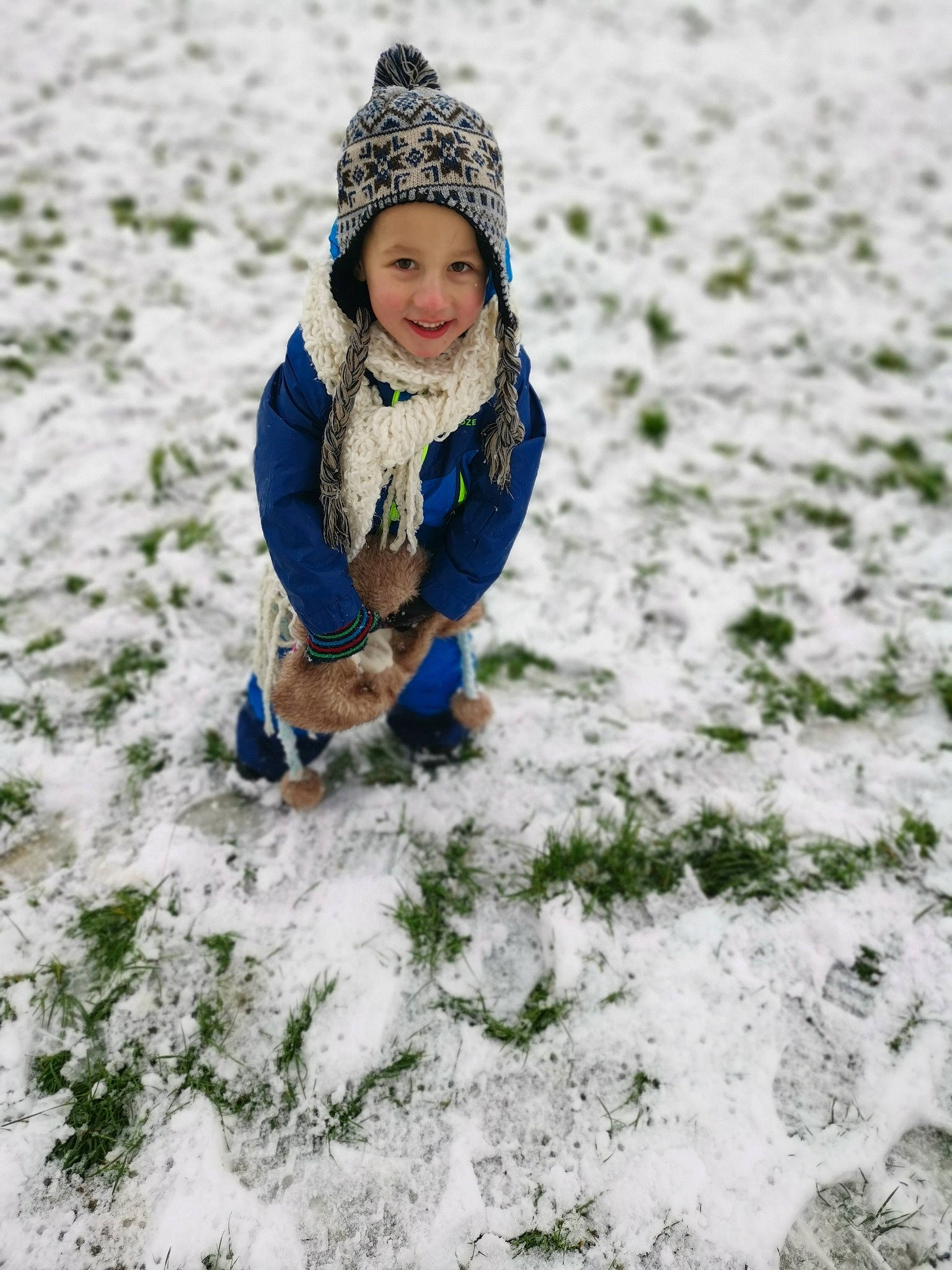 Rafael is registered to the contest to win money with this photo: cap, eye, face, freezing, grass, happy, head, headwear, jacket, joy, landscape, leisure, outdoor_recreation, outerwear, people_in_nature, person, recreation, smile, snow, toddler