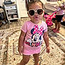 accessories, bag, child, clothing, face, female, footwear, furniture, girl, glasses, handbag, head, person, photography, portrait, shoe, shorts, sleeve, sunglasses, t_shirt
