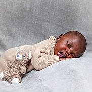 Eric is registered to the contest to win money with this photo: baby, sleeping, teddy_bear, blanket, knitwear, cozy, infant, soft_texture, peaceful, portrait, child, cute, resting, comfort, cuddly_toy, warm, relaxation, homedecor, closeup, indoors
