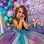 Vahiana participe au concours pour gagner de l'argent avec cette photo : child, girl, birthday, mermaid, costume, dress, balloons, party, smile, pose, headband, tulle, purple, blue, decoration, celebration, happy, long_hair, accessories, indoor