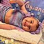 baby, smiling, mermaid_outfit, purple, headband, blanket, face, hand, balloons, party, name, decorations, shells, table, happy, child, portrait, indoors, cute, celebration
