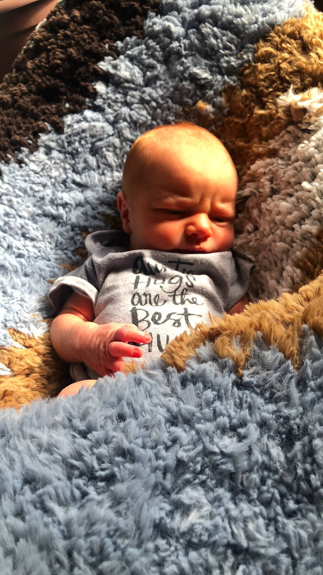 Blake is registered to the contest to win money with this photo: adaptation, baby, beauty, child, comfort, fun, fur, grass, happy, head, leaf, linens, organism, pattern, people_in_nature, person, rock, sitting, soil, toddler