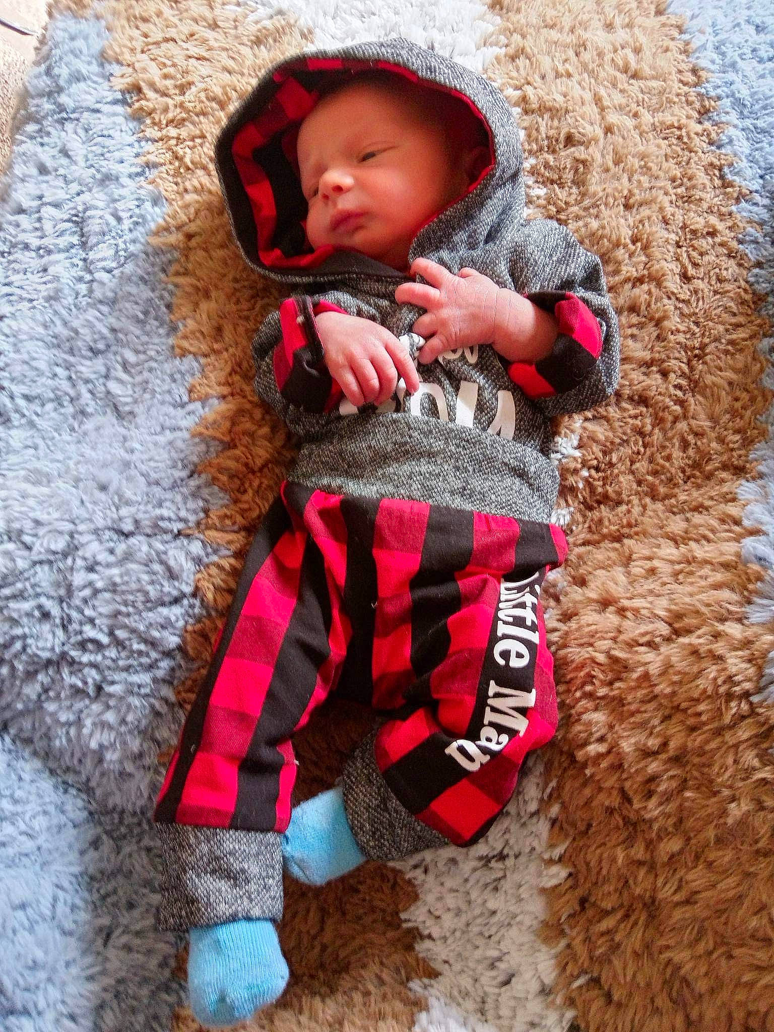 Blake is registered to the contest to win money with this photo: baby, baby_products, baby_toddler_clothing, cap, carmine, child, fashion_accessory, grass, head, magenta, pattern, people_in_nature, person, personal_protective_equipment, photograph, red, sitting, sleeve, sun_hat, toddler