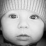 baby, infant, child, beanie, hat, close_up, portrait, black_and_white, eyes, eyelashes, lips, nose, cheeks, knit_hat, cozy, soft_focus, reflection, monochrome, face, adorable