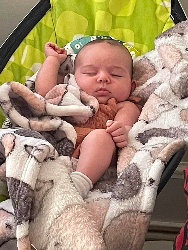 Lilliana is registered to the contest to win money with this photo: baby, baby_toddler_clothing, child, comfort, finger, grass, happy, human_leg, mammal, pattern, people_in_nature, person, pink, sitting, skin, thigh, toddler, toy, trunk, vertebrate