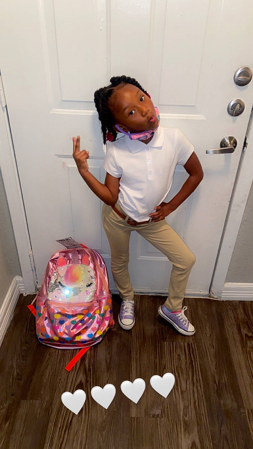 Aubreann is registered to the contest to win money with this photo: bag, balloon, door, elbow, eyewear, floor, flooring, fun, hardwood, knee, luggage_and_bags, party_supply, person, personal_protective_equipment, room, shoe, table, thigh, toy, white