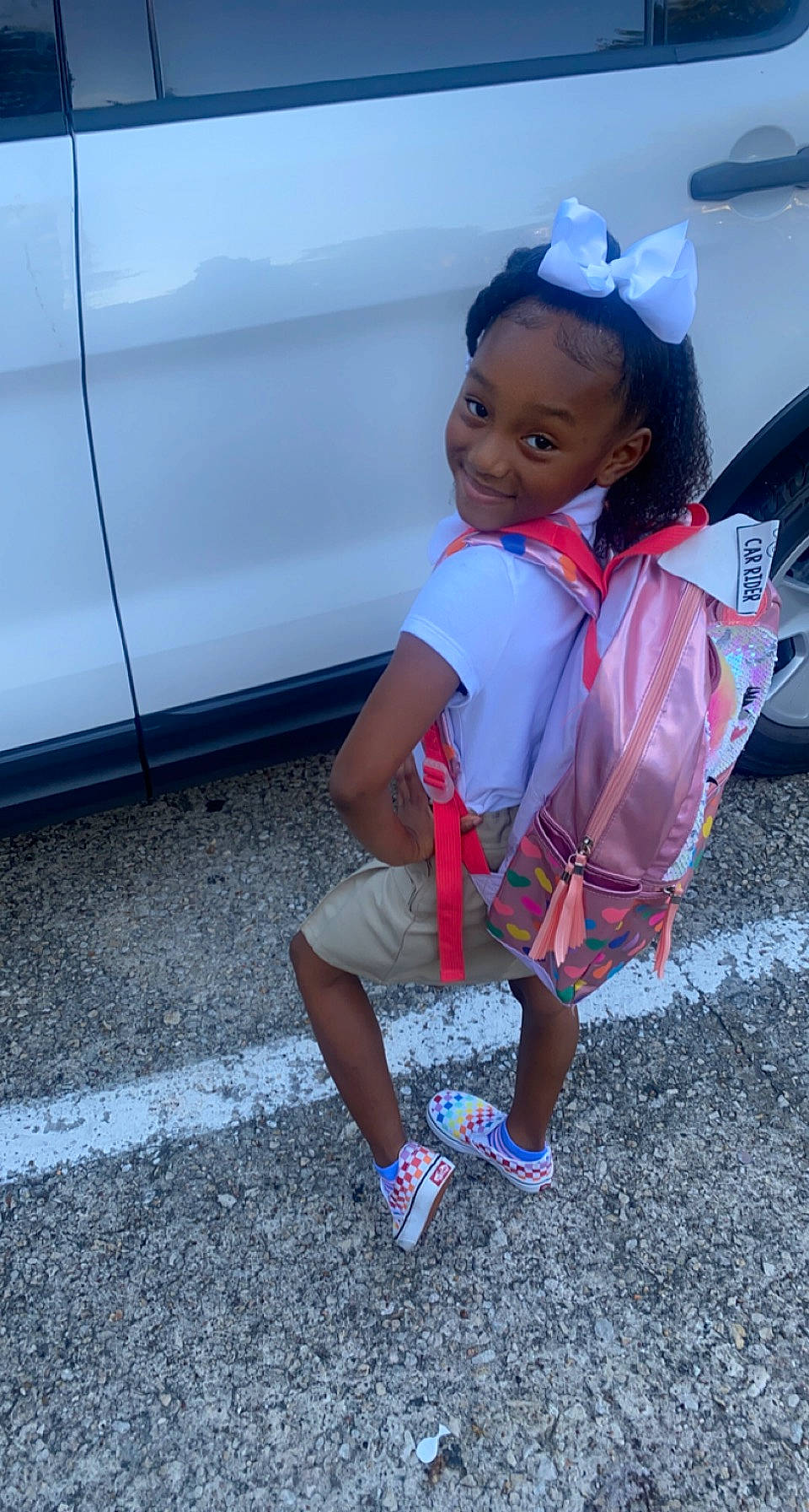 Aubreann joined the competition — help win amazing prizes! asphalt, automotive_exterior, automotive_lighting, automotive_tire, bumper, child, electric_blue, footwear, fun, happy, human_leg, joy, leg, leisure, magenta, person, road, sandal, smile, sneakers