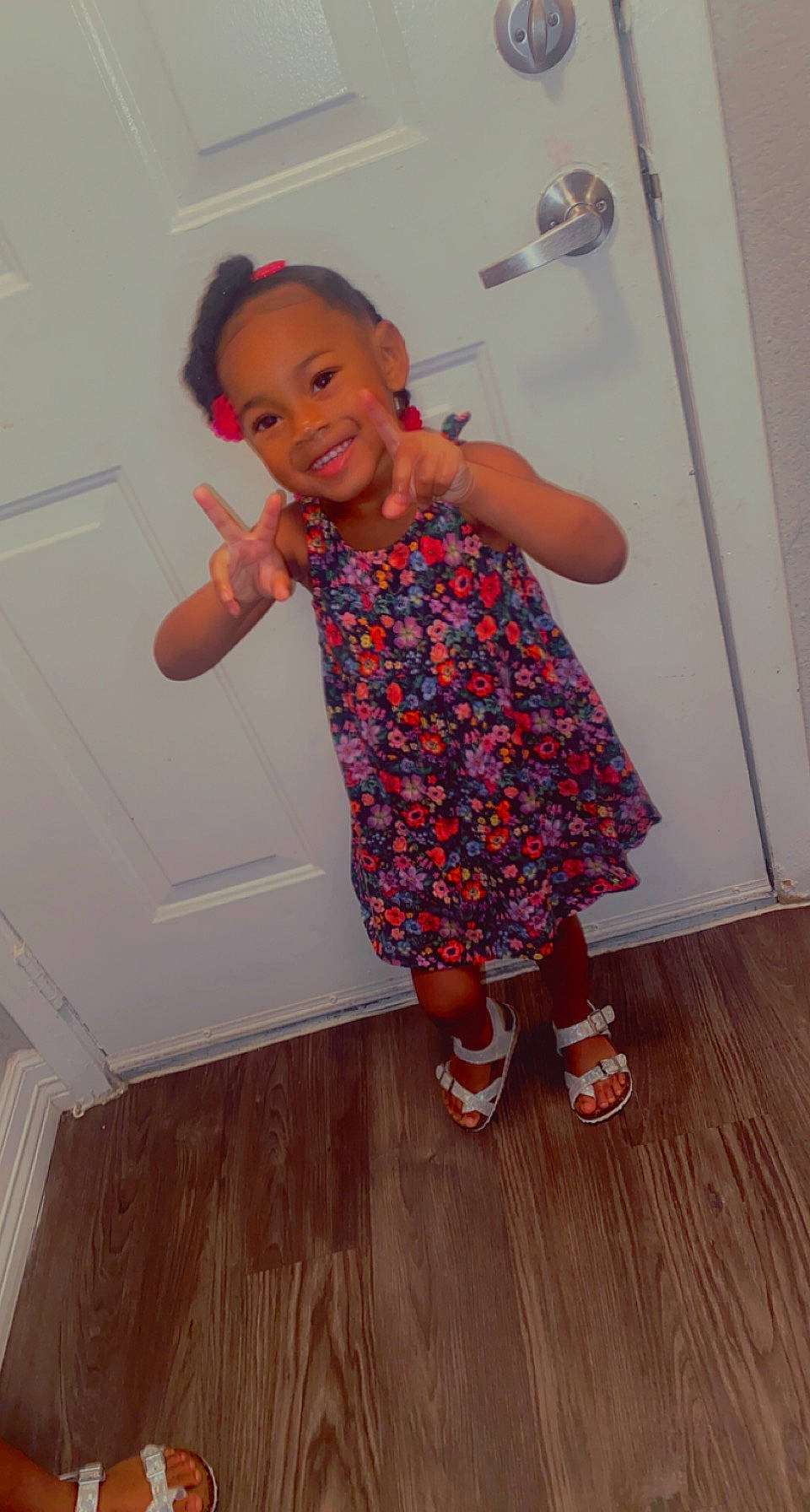 Aliyah is registered to the contest to win money with this photo: baby_toddler_clothing, floor, flooring, footwear, fun, happy, hardwood, human_leg, joy, laminate_flooring, magenta, pattern, person, skin, sleeve, smile, standing, thumb, toddler, varnish
