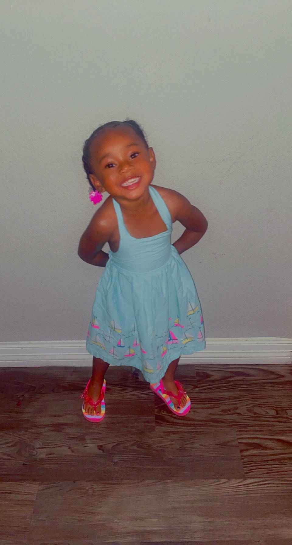 Aliyah is registered to the contest to win money with this photo: arm, baby_toddler_clothing, dress, finger, floor, flooring, gesture, hand, happy, human_body, human_leg, joint, joy, knee, magenta, neck, person, pink, skin, sleeve