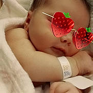 Elsa Dawn is registered to the contest to win money with this photo: baby, sleeping, blanket, infant, cute, cozy, face, hand, wristband, soft, child, peaceful, resting, person, closeup, eyewear, glasses, cuteaccessory, newborn, wrapped
