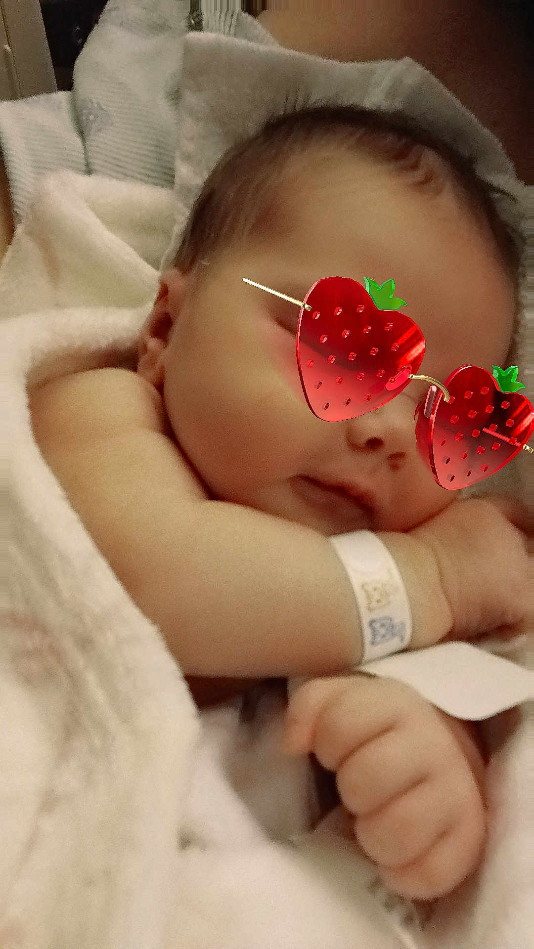 Elsa Dawn is registered to the contest to win money with this photo: baby, sleeping, blanket, infant, cute, cozy, face, hand, wristband, soft, child, peaceful, resting, person, closeup, eyewear, glasses, cuteaccessory, newborn, wrapped