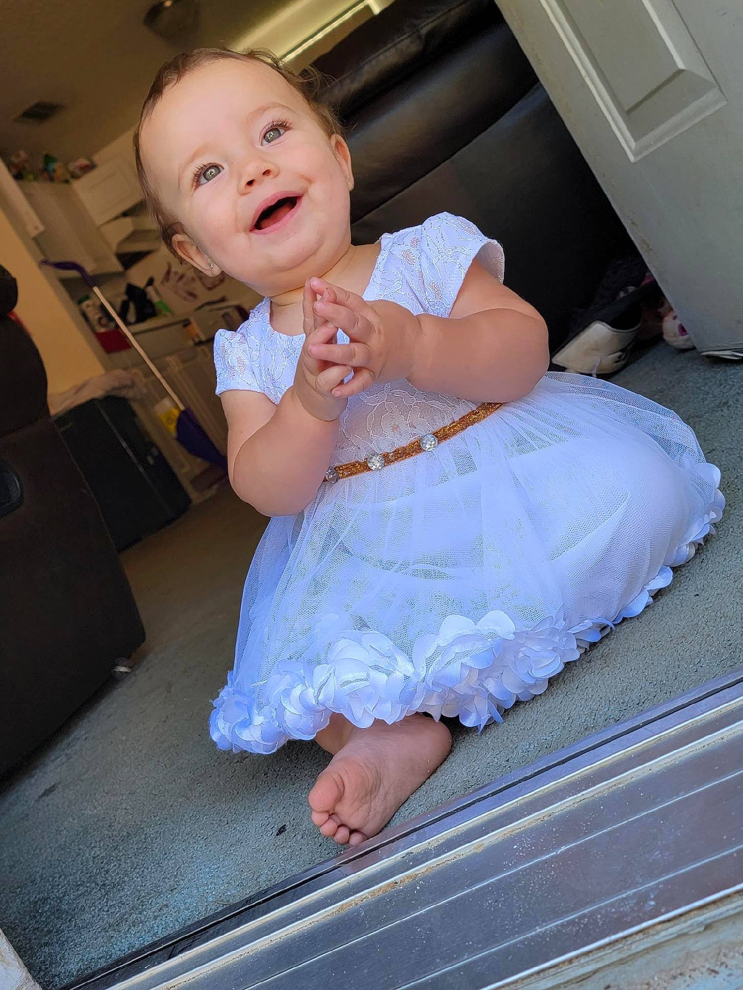Kalaya is registered to the contest to win money with this photo: baby, baby_toddler_clothing, child, comfort, dress, event, eye, flash_photography, floor, flooring, formal_wear, gesture, happy, head, human_leg, joy, leg, person, pink, skin