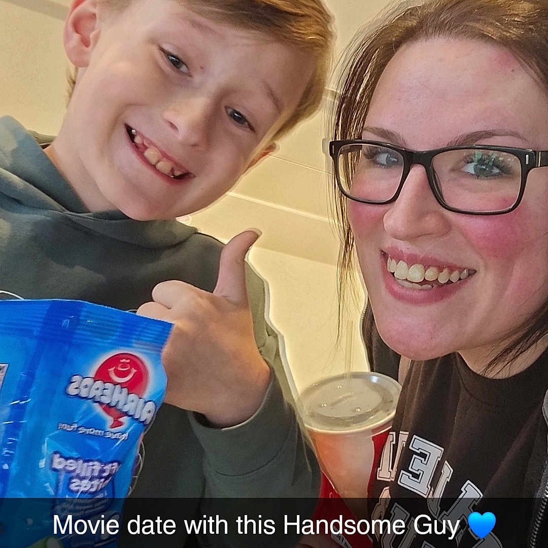 Mason is registered to the contest to win money with this photo: accessories, adult, bodypart, boy, child, clothing, cream, dessert, face, female, finger, glasses, hand, head, male, person, photography, portrait, t_shirt, woman