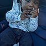 Khalani joined the competition — help win amazing prizes! baby, child, infant, cute, smiling, hair_bows, sweater, jeans, car_seat, blanket, hands, face, dark_skin, curly_hair, earrings, outdoor_light, blue_jacket, portrait, cozy, comfort