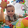 baby, infant, playmat, plush_toy, giraffe_toy, star_pillow, teether, colorful, indoor, child, cute, smiling, crawling, soft_toys, person, young_child, bright, happy, toy, toddler