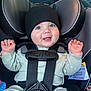 Rhett is registered to the contest to win money with this photo: baby, car_seat, child, smiling, pajamas, hat, seatbelt, infant, safety, cute, indoors, child_seat, happy, young_child, portrait, car_interior, hands, face, clothing, seat