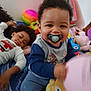 Adr participe au concours pour gagner de l'argent avec cette photo : toddler, child, pacifier, plush_toy, balloon, smiling, indoor, bed, blanket, toy, person, happy, curly_hair, clothing, playtime, young_child, portrait, relaxing, colorful, casual