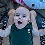 Bentley is registered to the contest to win money with this photo: baby, child, blue_eyes, green_shirt, tank_top, smiling, happy, infant, person, legs, diaper, outdoor, float, inflatable, summer, closeup, face, skin, expression, joy