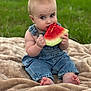 baby, child, watermelon, denim_overalls, blanket, grass, outdoor, summer, food, fruit, cute, sitting, barefoot, eating, portrait, greenery, happy, skin, infant, nature